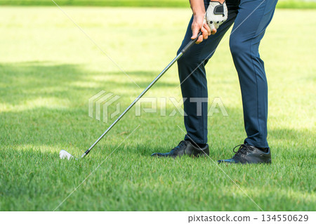 Golfer's feet wearing golf shoes Golfer's feet wearing golf shoes 134550629