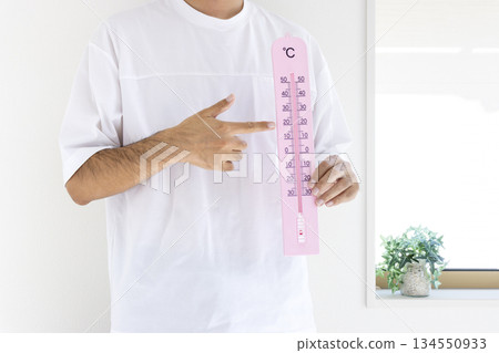 Man holding a large thermometer (Japanese, faceless, 30s) _ Summer Man holding a large thermometer (Japanese, faceless, 30s) _ Summer 134550933