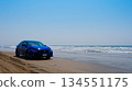 A beach driving scene where technology and nature intersect 134551175