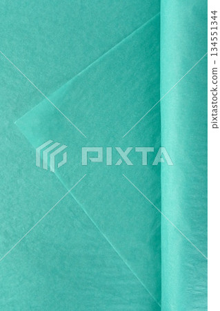Soft turquoise tissue wrapping material for flowers stacked in sheets isolated on white background used for bouquet presentation decor and packaging Soft turquoise tissue wrapping material for flowers stacked in sheets isolated on white background used for bouquet presentation decor and packaging 134551344