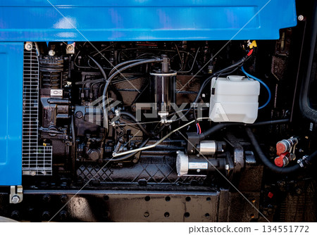 Modern new agricultural tractor engine. Machinery and equipment Modern new agricultural tractor engine. Machinery and equipment 134551772
