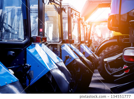Rows of modern tractors. Industrial details. Agricultural Rows of modern tractors. Industrial details. Agricultural 134551777