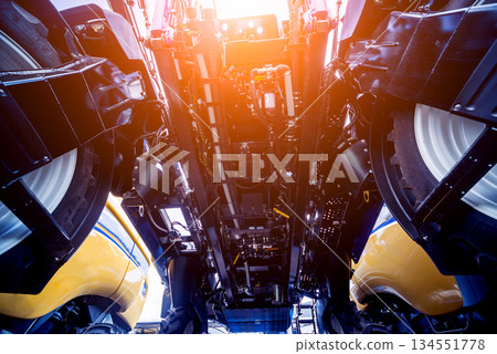 Modern agricultural machinery and equipment. Yellow agricultural harvester. Modern agricultural machinery and equipment. Yellow agricultural harvester. 134551778