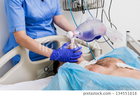 Doctors give resuscitation to a male patient in the emergency room. Doctors give resuscitation to a male patient in the emergency room. 134551818