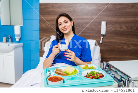 Tray with breakfast for the young female patient.  134551901