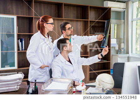 Doctors team having medical council in hospital. Discussing medical issues. Doctors team having medical council in hospital. Discussing medical issues. 134551948