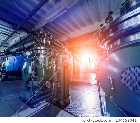 Interior of modern natural oil factory. The piping, pumps and motors Interior of modern natural oil factory. The piping, pumps and motors 134552041
