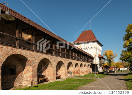 Historic Transylvanian Fortress Targu Mures Defensive Walls and Arches Under Clear Sky Historic Transylvanian Fortress Targu Mures Defensive Walls and Arches Under Clear Sky 134552399