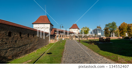Historic Transylvanian Fortress Targu Mures Defensive Walls and Arches Under Clear Sky Historic Transylvanian Fortress Targu Mures Defensive Walls and Arches Under Clear Sky 134552407