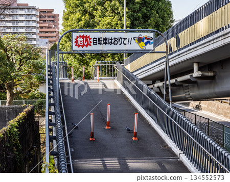 Warning sign prohibiting pushing bicycles (riding bicycles) on footbridges Warning sign prohibiting pushing bicycles (riding bicycles) on footbridges 134552573