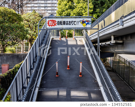 Warning sign prohibiting pushing bicycles (riding bicycles) on footbridges Warning sign prohibiting pushing bicycles (riding bicycles) on footbridges 134552581