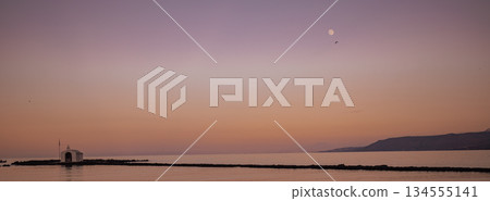 Minimalist seascape with Agios Nikolaos chapel and distant moon Crete Minimalist seascape with Agios Nikolaos chapel and distant moon Crete 134555141