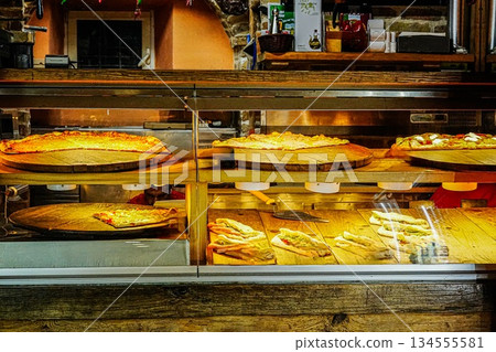 Pizza Cafe Window Display in Evening Light Pizza Cafe Window Display in Evening Light 134555581