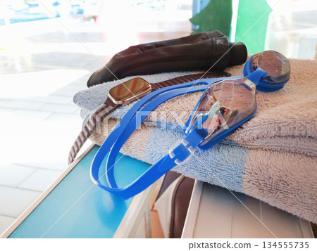 Swimming equipment. Glasses and smart watch. Technology and sports. Health and lifestyle. Swimming equipment. Glasses and smart watch. Technology and sports. Health and lifestyle. 134555735