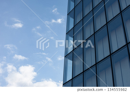 Modern architecture and cloudy blue sky on background 134555982