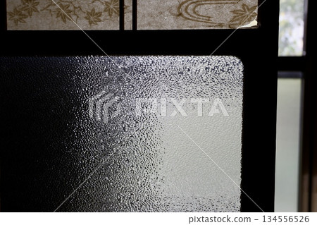 Glass door of an old house Glass door of an old house 134556526