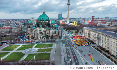 Awe drone point of view on Berlin Cathedral and opposite Christmas market and Ferris Wheel Awe drone point of view on Berlin Cathedral and opposite Christmas market and Ferris Wheel 134556757