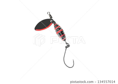 Metal fishing lure isolated on white background. Spinner lure isolated. Metal fishing lure isolated on white background. Spinner lure isolated. 134557014