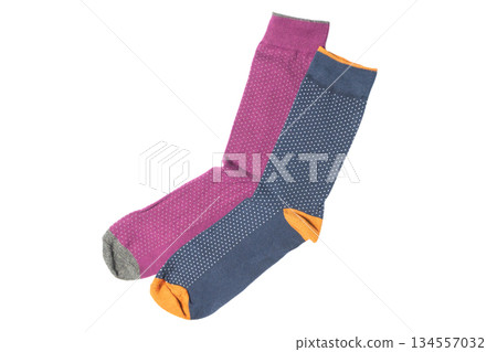 Pair socks with different lines isolated on white background. Colorful socks son white background. Colored socks on the leg isolated on white background 134557032