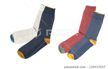 Pair socks with different lines isolated on white background. Colorful socks son white background. Colored socks on the leg isolated on white background Pair socks with different lines isolated on white background. Colorful socks son white background. Colored socks on the leg isolated on white background 134557037
