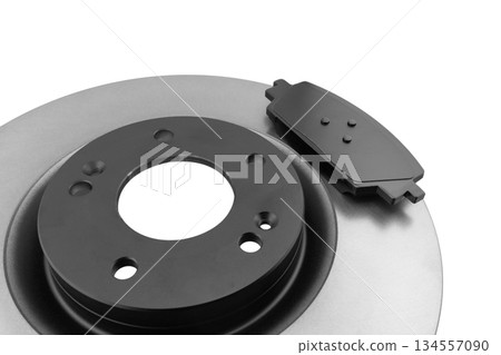 Brake discs and brake pads isolated on white background. Auto parts. Brake disc rotor isolated on white. Braking disk. Car part. Quality spare parts for car service or maintenance Brake discs and brake pads isolated on white background. Auto parts. Brake disc rotor isolated on white. Braking disk. Car part. Quality spare parts for car service or maintenance 134557090