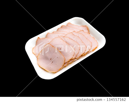 Top view of sliced smoked beef meat isolated on black background. Raw beef ham isolated over white Top view of sliced smoked beef meat isolated on black background. Raw beef ham isolated over white 134557162