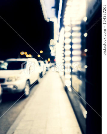 Blurred background. Night city. Blurred silhouette of buildings, bokeh spots of glowing lanterns. Blurred view of city street.Bokeh effect. Defocused night street with bokeh blur of street lights Blurred background. Night city. Blurred silhouette of buildings, bokeh spots of glowing lanterns. Blurred view of city street.Bokeh effect. Defocused night street with bokeh blur of street lights 134557205