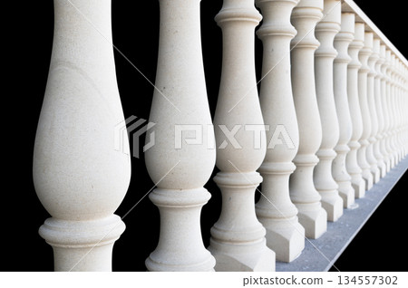 Stonework. Element of a stone interior staircase. Srone baluster close-up view. Handmade baluster for the stairs. Home exterior details Stonework. Element of a stone interior staircase. Srone baluster close-up view. Handmade baluster for the stairs. Home exterior details 134557302