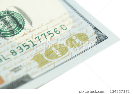 Macro shot image of the corner of a 100 dollar bill banknotes. Concept of financial success. Background of 100 dollar bills. One hundred dollars. 134557371