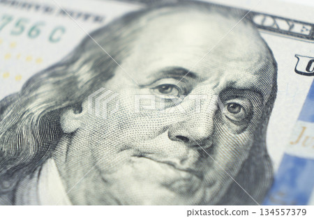 Close up view Portrait of Benjamin Franklin on the one hundred dollar bill. Background of the money. 100 dollar bill with Benjamin Franklin eyes macro shot. 134557379