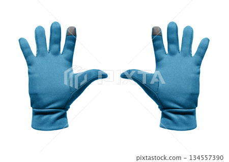 Casual blue volumetric gloves isolated on white background. Blue winter warm wool gloves isolated on white. 134557390