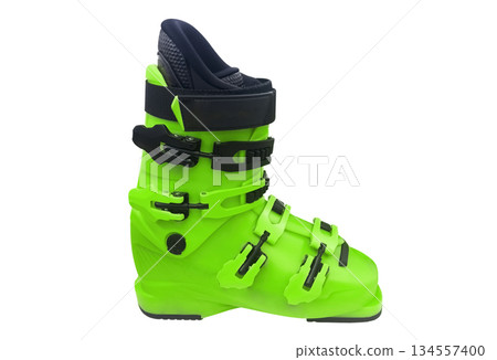 Ski boots isolated on white background. Modern sport equipment isolated. Ski boots isolated on white background. Modern sport equipment isolated. 134557400