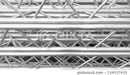 Aluminium profile manufacturing. Structural metal aluminium shapes. Aluminium profiles texture for constructions. Aluminium constructions factory background. Aluminium profile manufacturing. Structural metal aluminium shapes. Aluminium profiles texture for constructions. Aluminium constructions factory background. 134557410