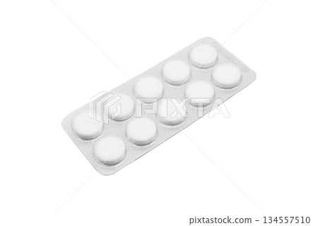 Macro shot pile of tablets pill in silver blister packaging isolated on white background. Aluminium foil blister pack. Pharmacy products. Medicine pills and drugs close up. Pills background 134557510