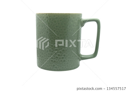 Green ceramic cup isolated on a white background. Green ceramic cup isolated on a white background. 134557517