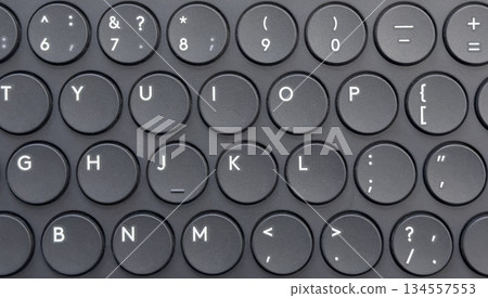 Modern laptop computer keyboard. Laptop keyboard. Detail of the new and ergonomic computer keyboard with lighting Modern laptop computer keyboard. Laptop keyboard. Detail of the new and ergonomic computer keyboard with lighting 134557553