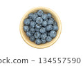 Ripe sweet blueberry. Fresh blueberries isolated on white background. Macro shot texture of blueberry berries in wooden cup. Blueberry berries pattern close up 134557590
