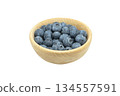 Ripe sweet blueberry. Fresh blueberries isolated on white background. Macro shot texture of blueberry berries in wooden cup. Blueberry berries pattern close up 134557591