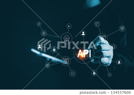 Business hand touching API connection interface digital network icons representing application programming interface system integration cloud services data exchange modern backend technology solutions 134557600