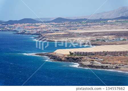 Greenhouses on coast near Tenerife airport, sunny summer day, Canary Islands, Spain Greenhouses on coast near Tenerife airport, sunny summer day, Canary Islands, Spain 134557662