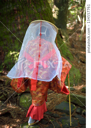 Japanese woman wearing traditional Heian Period costume at the Kumano Kodo Pilgrimage Route in Wakayama prefecture of Japan Japanese woman wearing traditional Heian Period costume at the Kumano Kodo Pilgrimage Route in Wakayama prefecture of Japan 134557761
