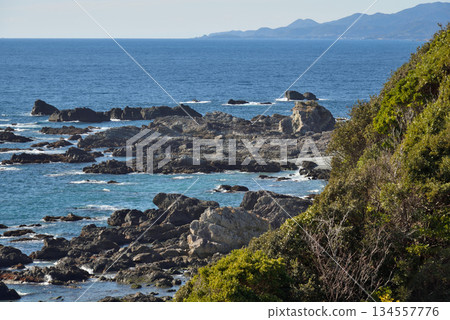 Rocky Coastline with Distant Mountains Rocky Coastline with Distant Mountains 134557776