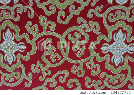 Ornate Red and Gold Fabric with Intricate Patterns Ornate Red and Gold Fabric with Intricate Patterns 134557793