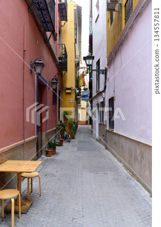 Narrow streets of Casco Antiguo historic Old town city centre district of the capital of Andalusia, Seville, Spain Narrow streets of Casco Antiguo historic Old town city centre district of the capital of Andalusia, Seville, Spain 134557811