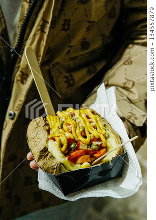 Overhead View of Mashed Potatoes and Mixed Salad in Hand 134557879