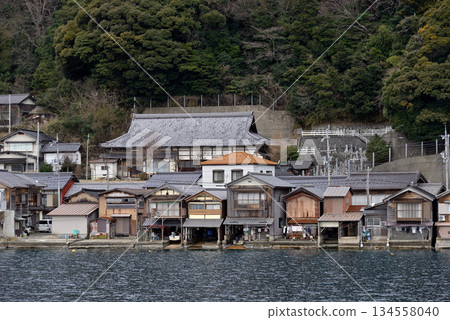 Traditional wooden fishermen Funaya boathouses in Ine, north Kyoto prefecture on the Sea of Japan Traditional wooden fishermen Funaya boathouses in Ine, north Kyoto prefecture on the Sea of Japan 134558040