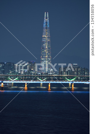 Night view of Hangang river and Lotte World Tower skyscraper in Seoul, South Korea Night view of Hangang river and Lotte World Tower skyscraper in Seoul, South Korea 134558056