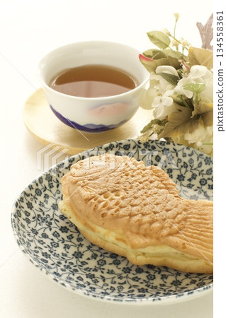 Taiyaki and Japanese tea on a plate Taiyaki and Japanese tea on a plate 134558361