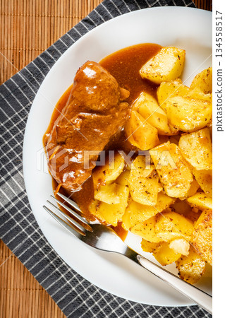 Beef roulade with baked potatoes. Beef roulade with baked potatoes. 134558517