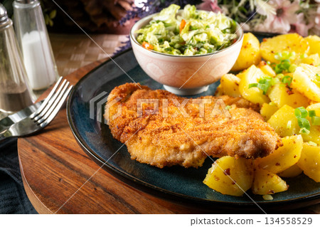 Pork chop with potatoes. 134558529